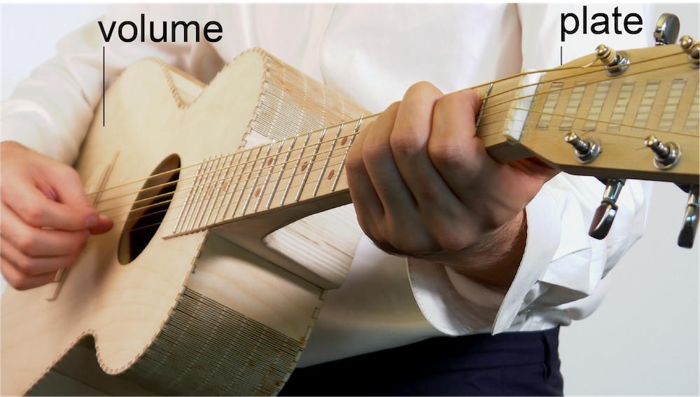 Project number 5. Structure-Preserving Editing. A wooden acoustic guitar made with laser cutting. Its body is a volume and its neck consists of plates.