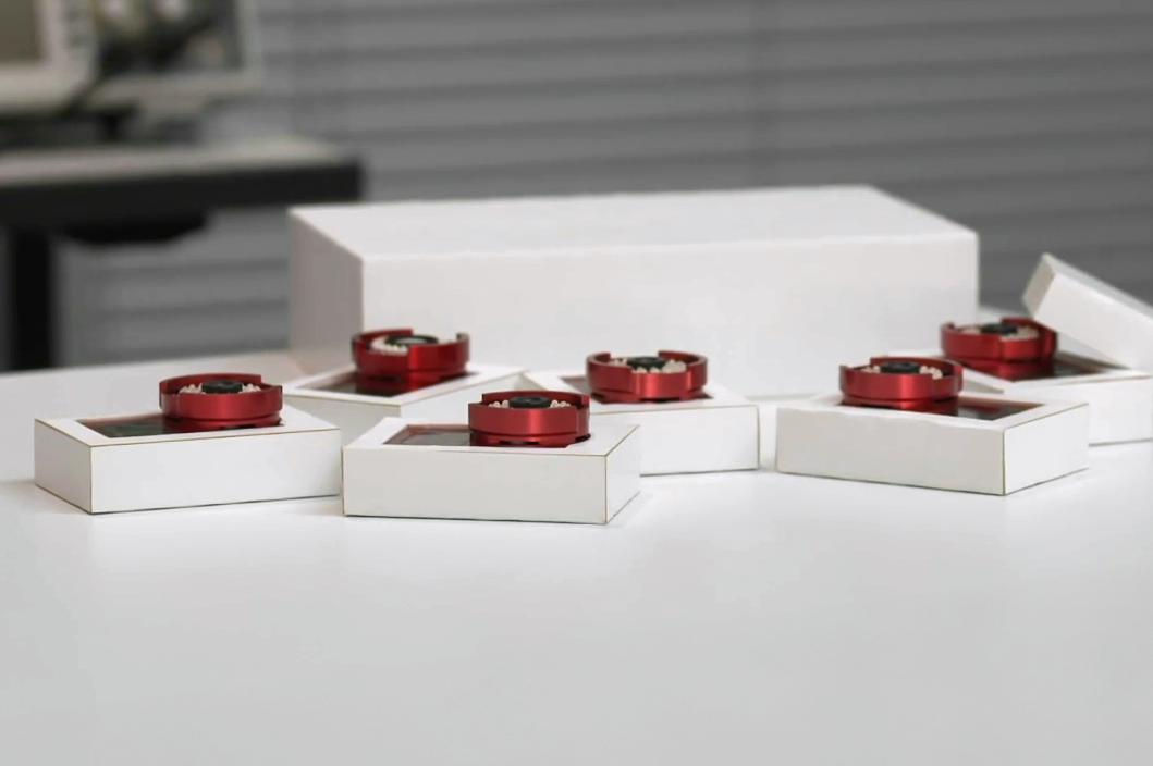 Project number 7. PopCore. Several small white boxes made from PopCore on a table. They have a clean, professional look.